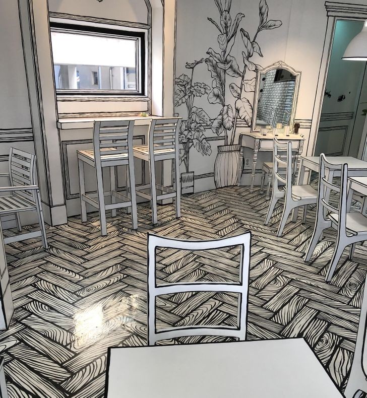 Kawiarnia w stylu 2D, wyglądająca na żywcem wyjętą z kolorowanki
